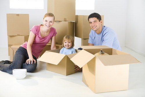 Professional movers handling office equipment in Finchley