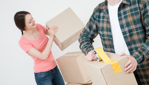 Professional team handling furniture pick-up in storage Finchley