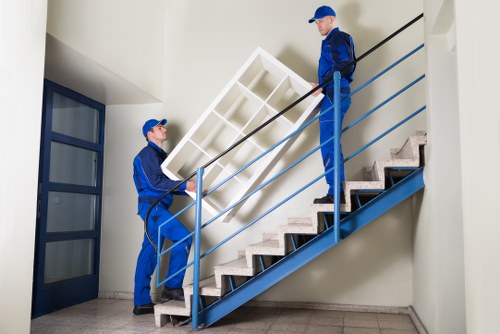 Professional packers handling items in Storage Finchley